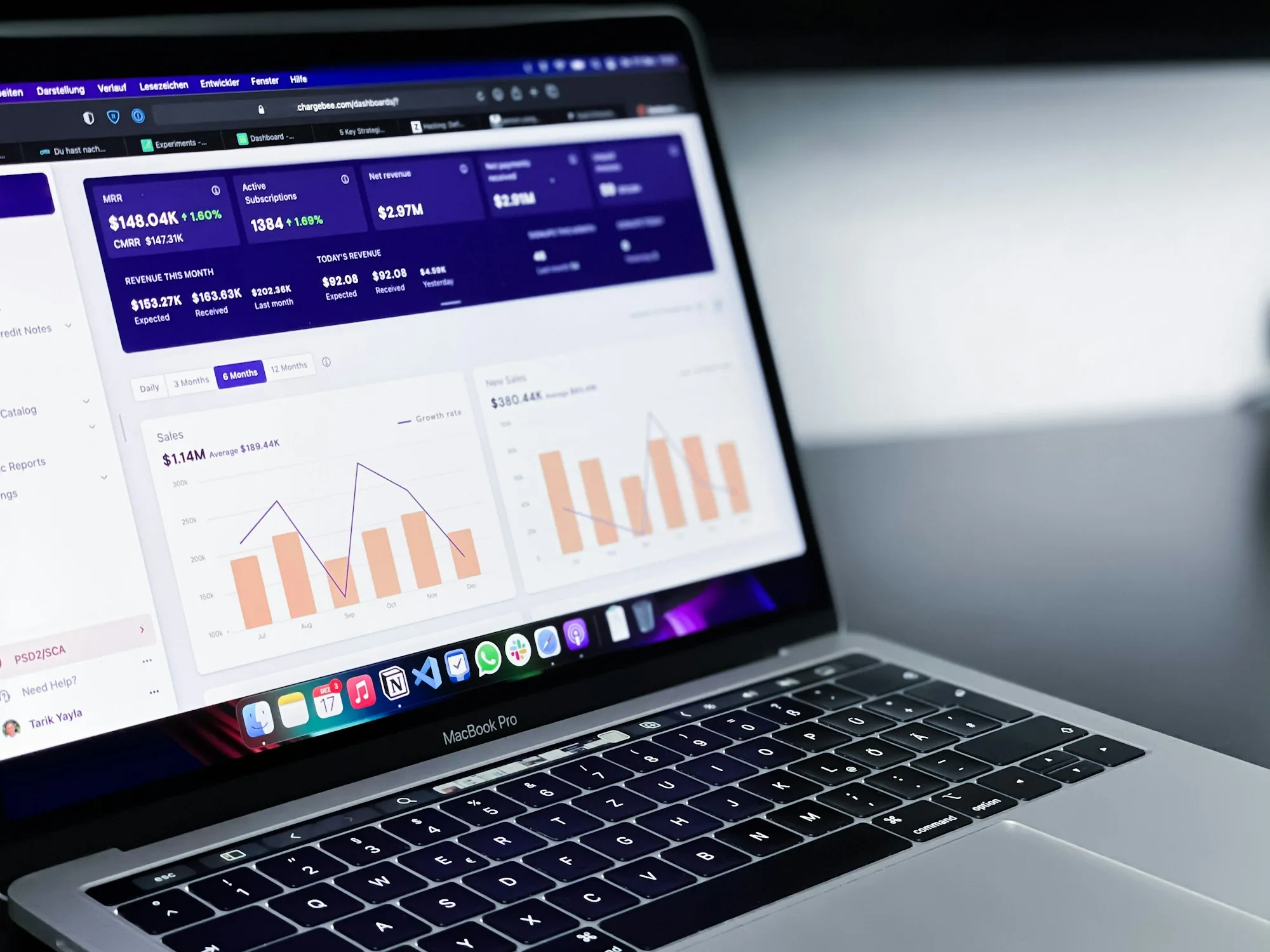 Laptop showing a marketing analytics dashboard with charts