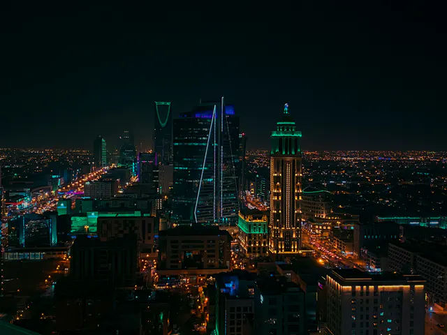 Riyadh skyline at night with the Kingdom Centre lit up